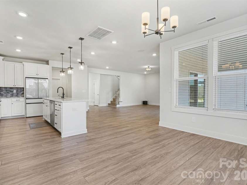 4266 Tournette Drive, Fort Mill, SC 29707.  MLS# CAR4338531, YatesRealty ID 7903. Dining into kitchen & living room