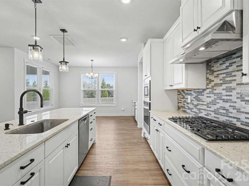 4266 Tournette Drive, Fort Mill, SC 29707.  MLS# CAR4338531, YatesRealty ID 7903. Kitchen into Dining