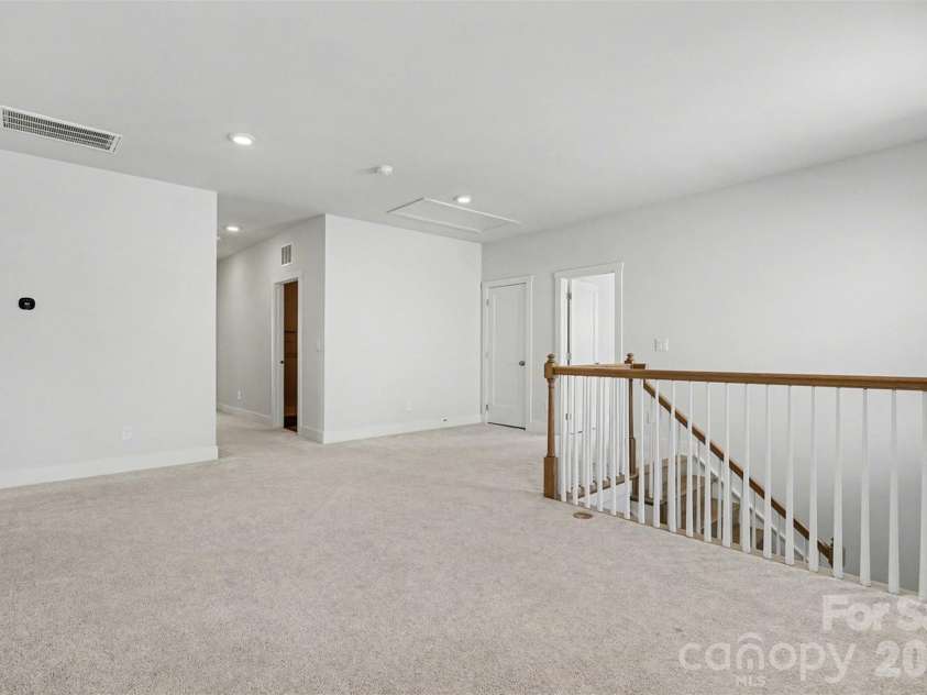 4266 Tournette Drive, Fort Mill, SC 29707.  MLS# CAR4338531, YatesRealty ID 7903. Upstairs loft landing