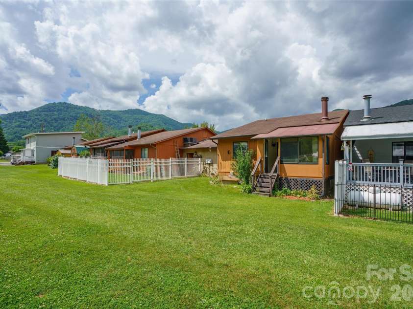 94 Market Street, Maggie Valley, NC 28751.  MLS# CAR4277066, YatesRealty ID 7907. Back yard for pets or gardinging