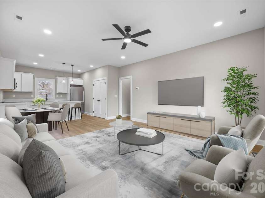 401 Lee Street, Mount Holly, NC 28120.  MLS# CAR4341029, YatesRealty ID 7909. Living, Dining, and Kitchen Virtually Staged