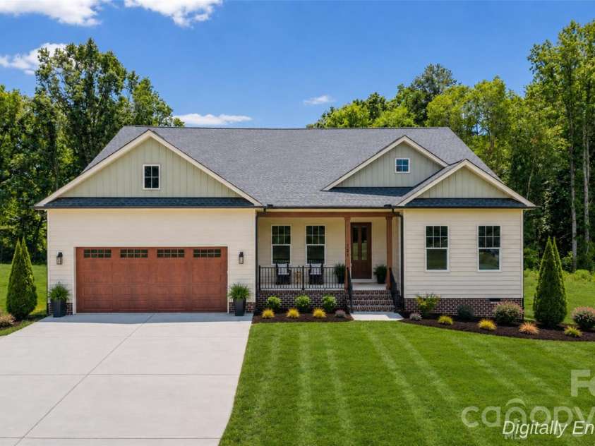 121 Juniper Road, Mooresville, NC 28115.  MLS# CAR4403335, YatesRealty ID 7912. 121 Juniper Rd Grass is Digitally Enhanced