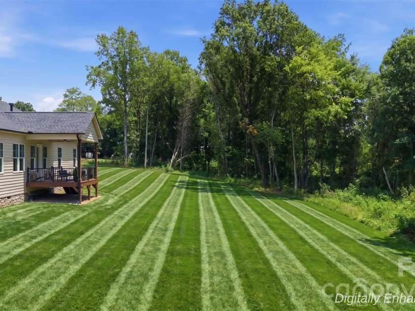 121 Juniper Road, Mooresville, NC 28115.  MLS# CAR4403335, YatesRealty ID 7912. Backyard (Digitally Enhanced Grass)