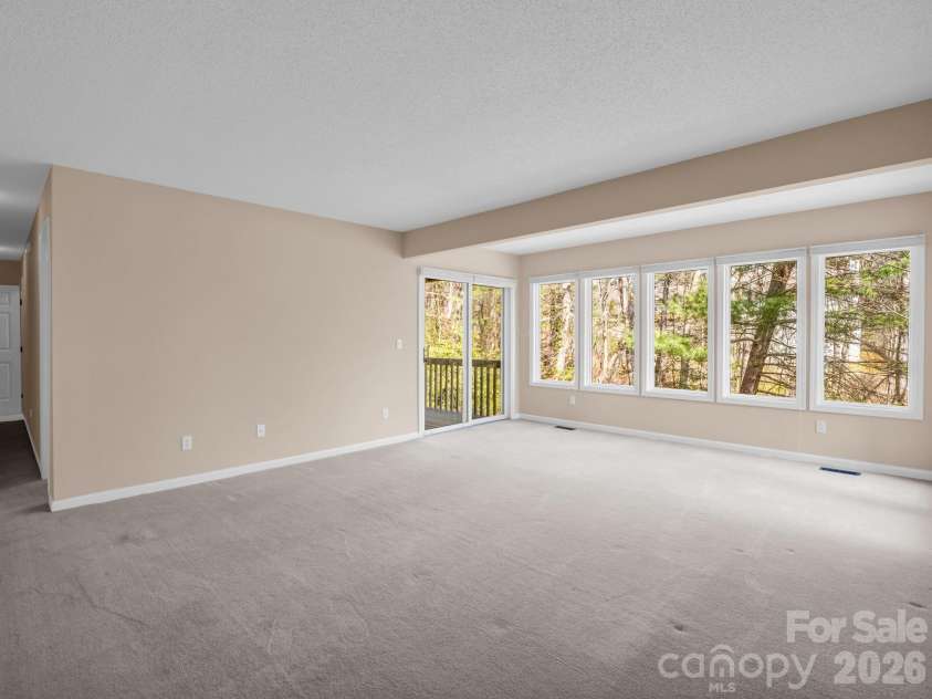 111 Broadmoor Drive, Flat Rock, NC 28731.  MLS# CAR4358626, YatesRealty ID 7915. Entry to lower deck from family room
