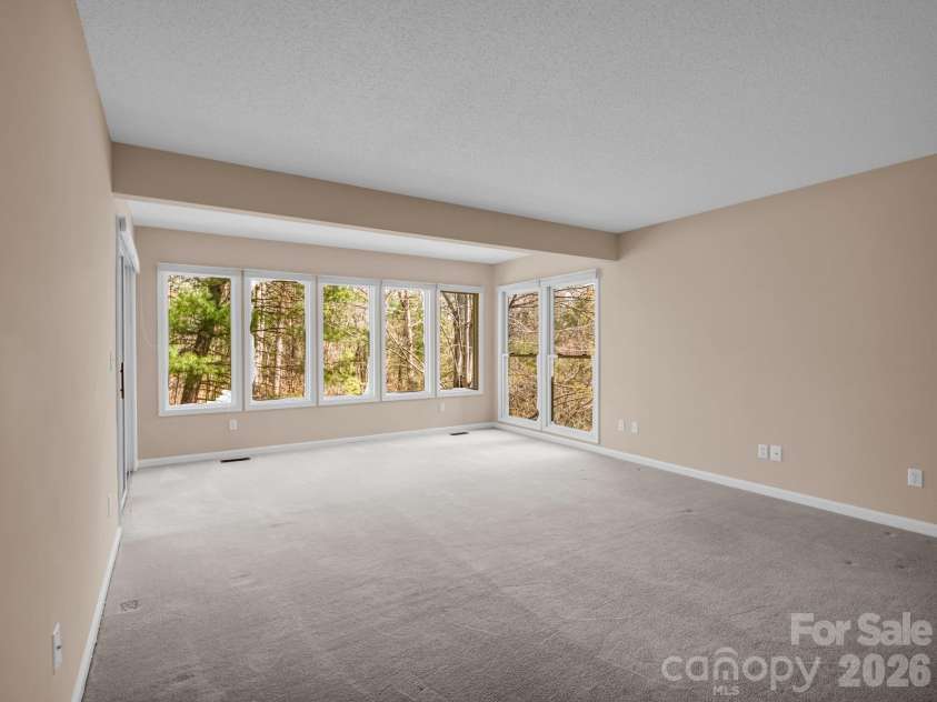 111 Broadmoor Drive, Flat Rock, NC 28731.  MLS# CAR4358626, YatesRealty ID 7915. Family room- ready for guest or just hanging out on movie night!