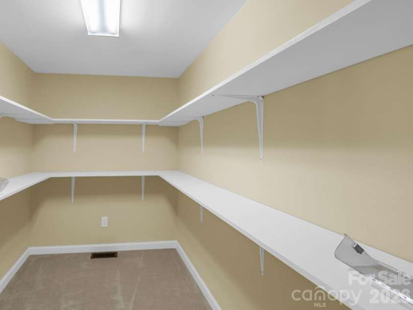 111 Broadmoor Drive, Flat Rock, NC 28731.  MLS# CAR4358626, YatesRealty ID 7915. Primary bedroom walk-in closet