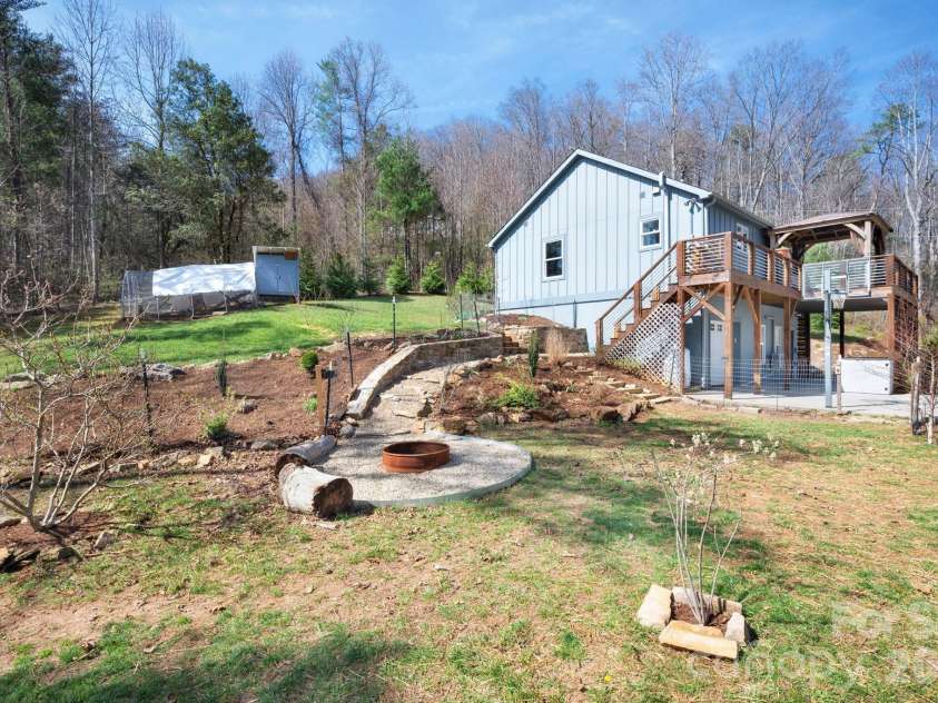 132 Peaceful View Drive, Fairview, NC 28730.  MLS# CAR4363151, YatesRealty ID 7917. Backyard fire pit overview