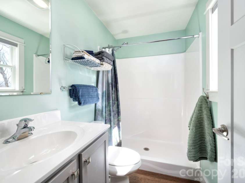 132 Peaceful View Drive, Fairview, NC 28730.  MLS# CAR4363151, YatesRealty ID 7917. Bathroom shower vanity view