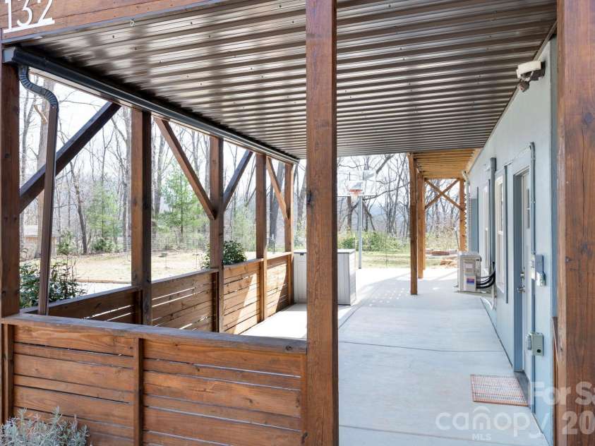 132 Peaceful View Drive, Fairview, NC 28730.  MLS# CAR4363151, YatesRealty ID 7917. Covered lower patio walkway