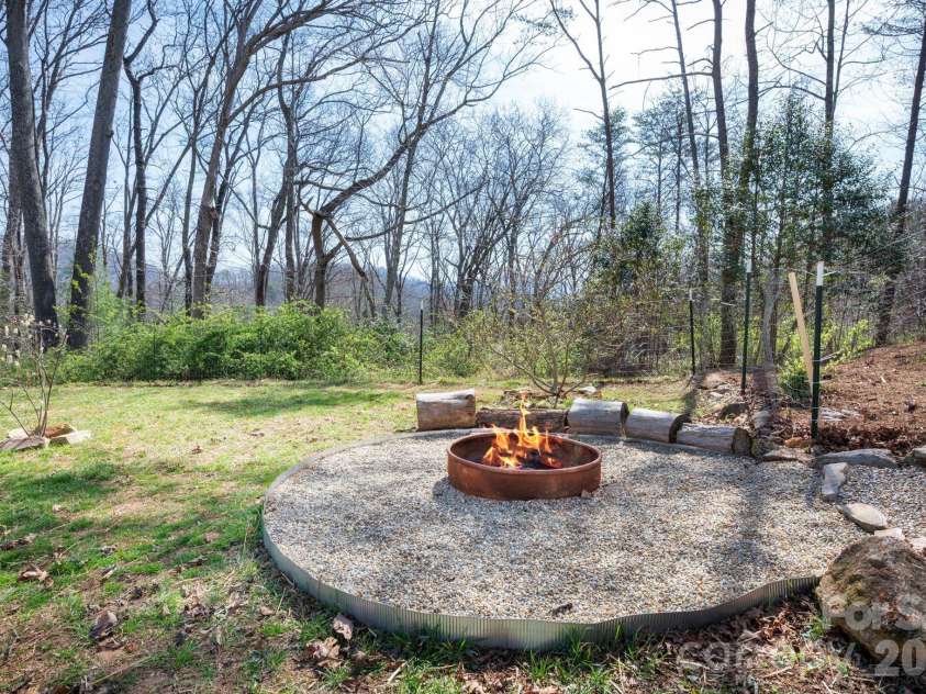 132 Peaceful View Drive, Fairview, NC 28730.  MLS# CAR4363151, YatesRealty ID 7917. Fire pit area