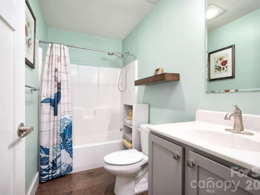 132 Peaceful View Drive, Fairview, NC 28730.  MLS# CAR4363151, YatesRealty ID 7917. Guest bathroom tub shower