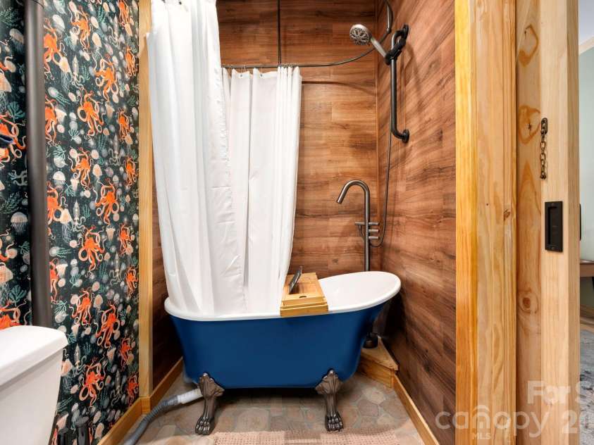 132 Peaceful View Drive, Fairview, NC 28730.  MLS# CAR4363151, YatesRealty ID 7917. Statement bathroom claw foot soaking tub