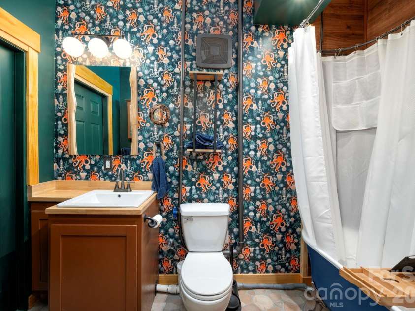 132 Peaceful View Drive, Fairview, NC 28730.  MLS# CAR4363151, YatesRealty ID 7917. Statement bathroom vanity view