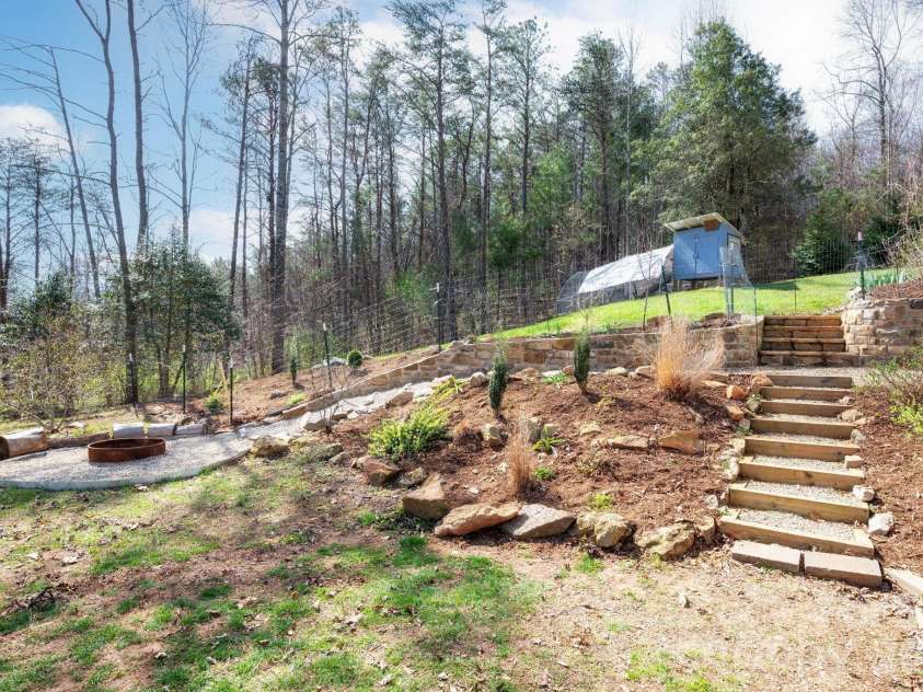 132 Peaceful View Drive, Fairview, NC 28730.  MLS# CAR4363151, YatesRealty ID 7917. Terraced backyard garden steps