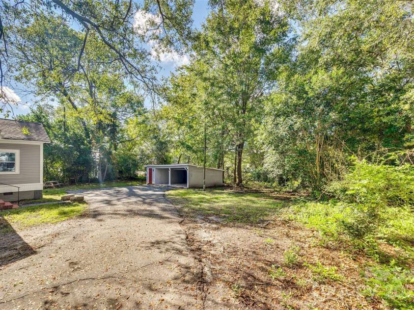 203 Kings Mountain Street, Clover, SC 29710.  MLS# CAR4277270, YatesRealty ID 7932. Rear driveway view