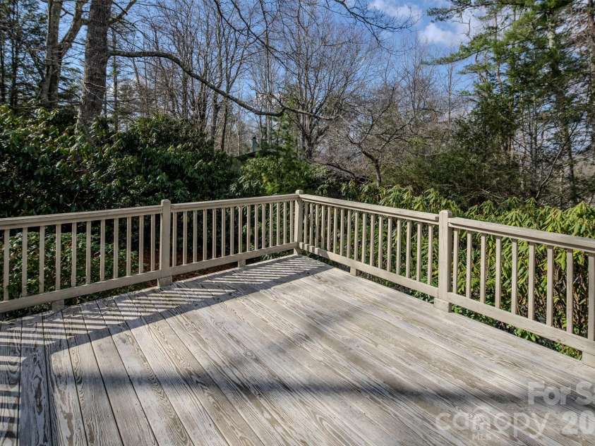117 Hickory Lane, Newland, NC 28657.  MLS# CAR4361948, YatesRealty ID 7940. Deck off sunroom