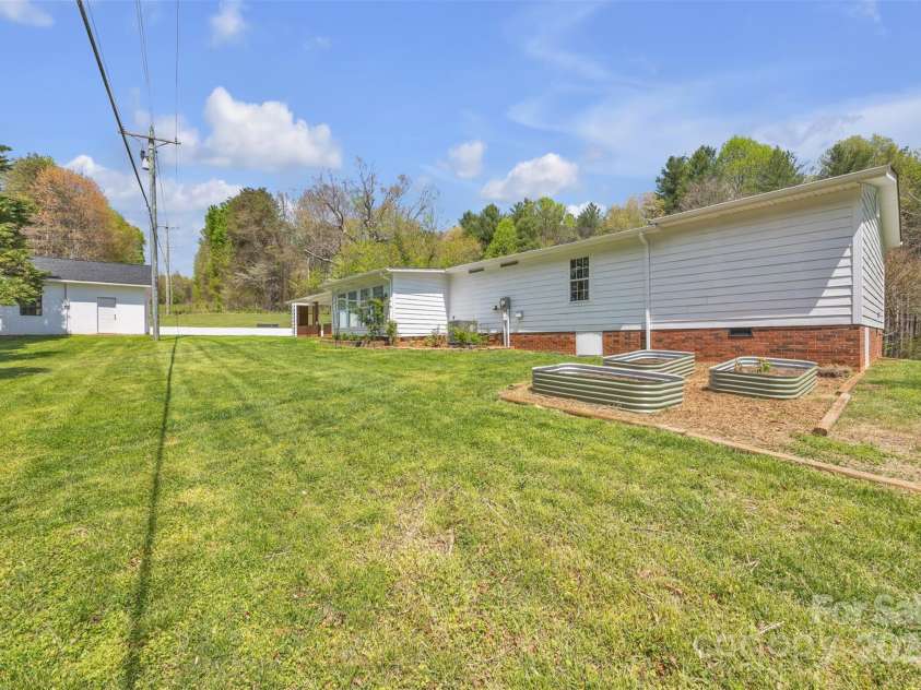 1975 Old Wilkesboro Road, Taylorsville, NC 28681.  MLS# CAR4243229, YatesRealty ID 7948. Backyard