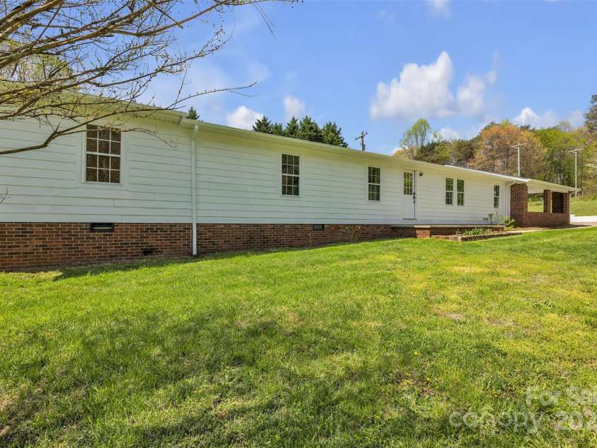 1975 Old Wilkesboro Road, Taylorsville, NC 28681.  MLS# CAR4243229, YatesRealty ID 7948. Front/Side View