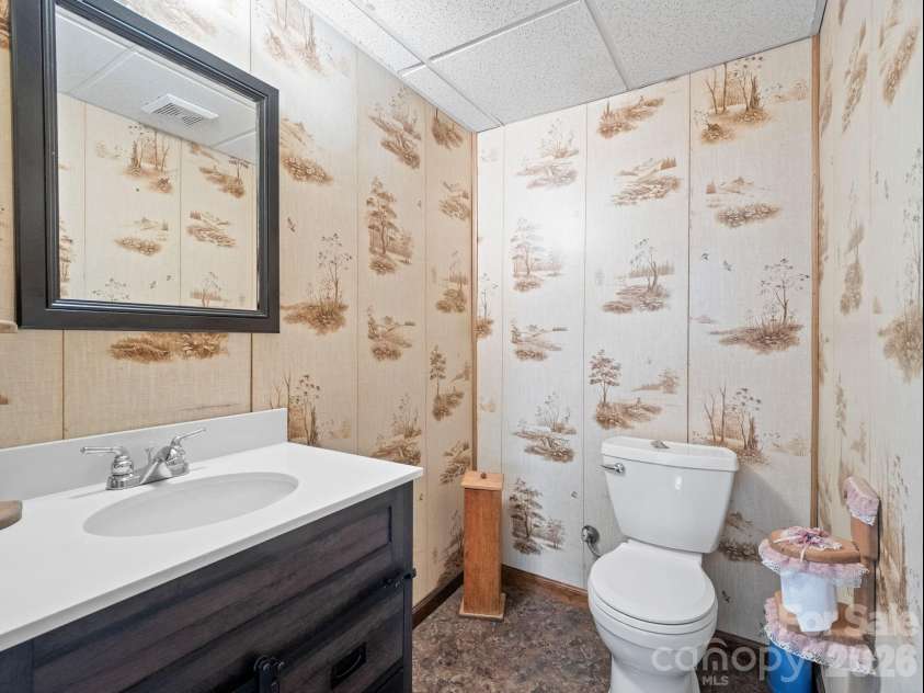 111 Buckeye Road, Lake Lure, NC 28746.  MLS# CAR4330936, YatesRealty ID 7952. Half bath in the finished basement.