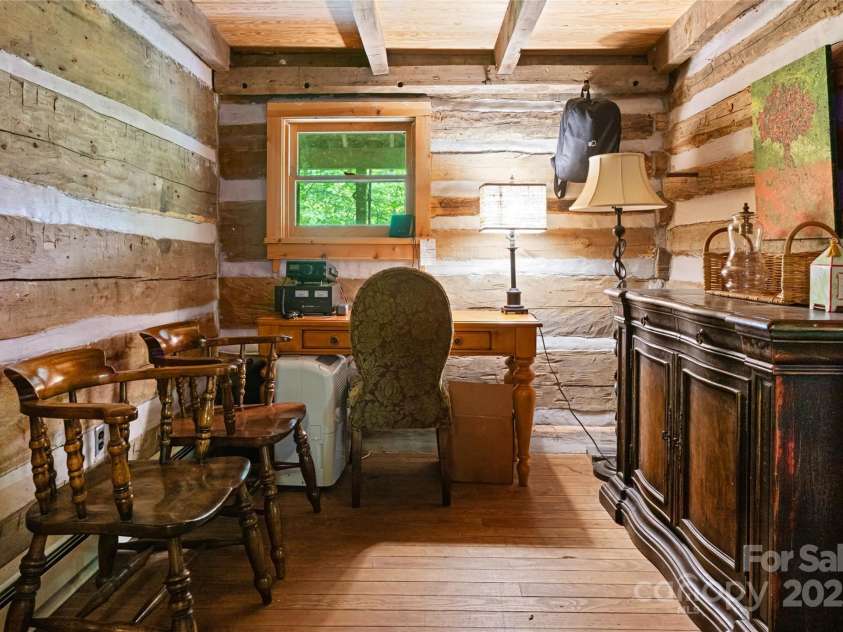 2395 Hortons Creek Road, Burnsville, NC 28714.  MLS# CAR4219244, YatesRealty ID 7959. Anteroom connection the two original cabins