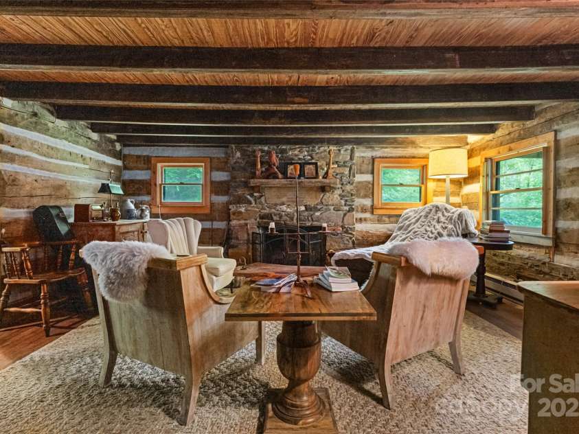 2395 Hortons Creek Road, Burnsville, NC 28714.  MLS# CAR4219244, YatesRealty ID 7959. The left side with its own entrance from the back porch.