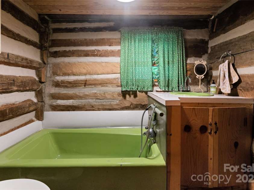 2395 Hortons Creek Road, Burnsville, NC 28714.  MLS# CAR4219244, YatesRealty ID 7959. The second full bathroom.