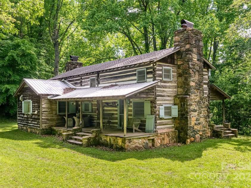 2395 Hortons Creek Road, Burnsville, NC 28714.  MLS# CAR4219244, YatesRealty ID 7959. Truly unique and authentic historic 1800's cabins!