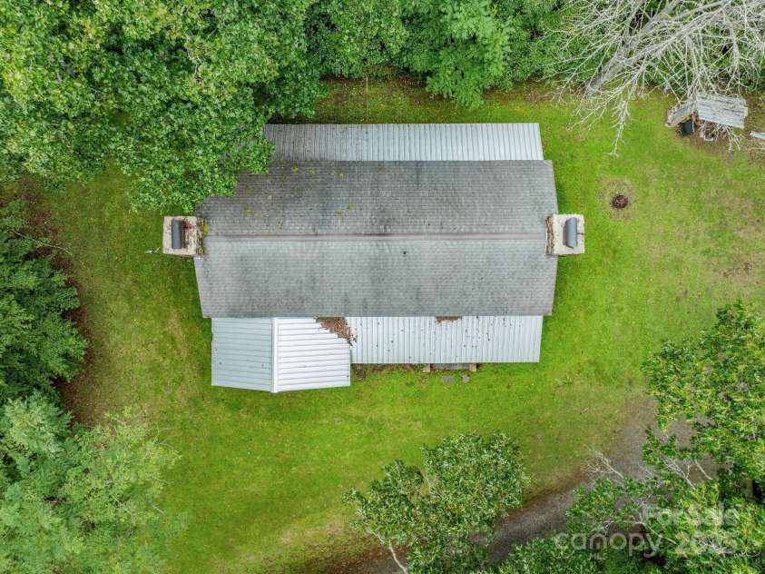 2395 Hortons Creek Road, Burnsville, NC 28714.  MLS# CAR4219244, YatesRealty ID 7959. View from above shows the level yard.