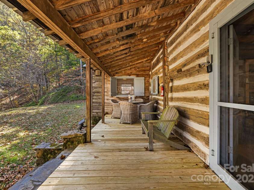 2395 Hortons Creek Road, Burnsville, NC 28714.  MLS# CAR4313609, YatesRealty ID 7959. Front porch entry