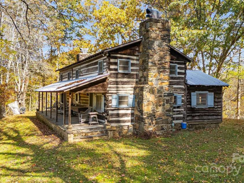 2395 Hortons Creek Road, Burnsville, NC 28714.  MLS# CAR4313609, YatesRealty ID 7959. Front/side of cabin