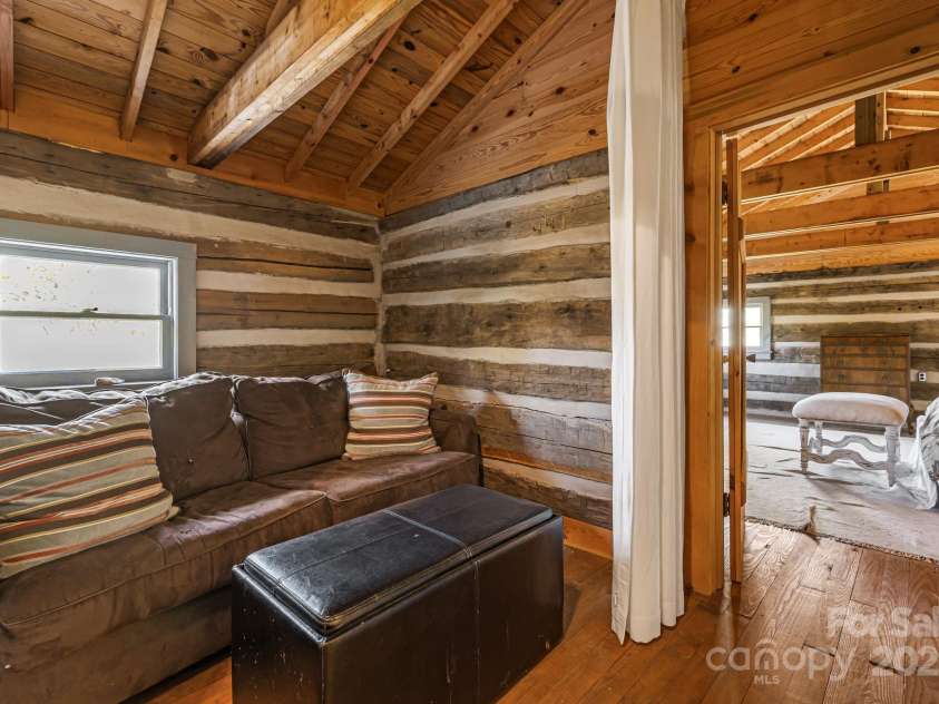 2395 Hortons Creek Road, Burnsville, NC 28714.  MLS# CAR4313609, YatesRealty ID 7959. Side sleeping/sitting area