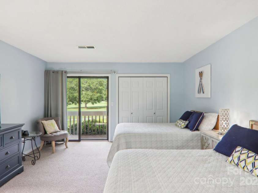 182 Lake Drive, Lake Lure, NC 28746.  MLS# CAR4170164, YatesRealty ID 7965. Large bedroom with priviate balcony with mountain views