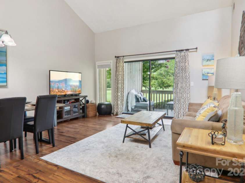 182 Lake Drive, Lake Lure, NC 28746.  MLS# CAR4170164, YatesRealty ID 7965. Living area flow out to back porch