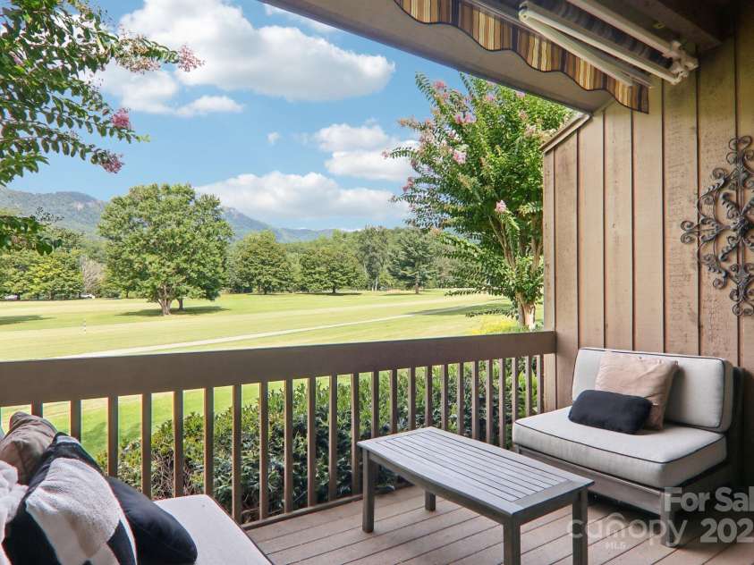 182 Lake Drive, Lake Lure, NC 28746.  MLS# CAR4170164, YatesRealty ID 7965. Stunning views from private covered porch of Bald Mountain and Bald Mountain Golf Course