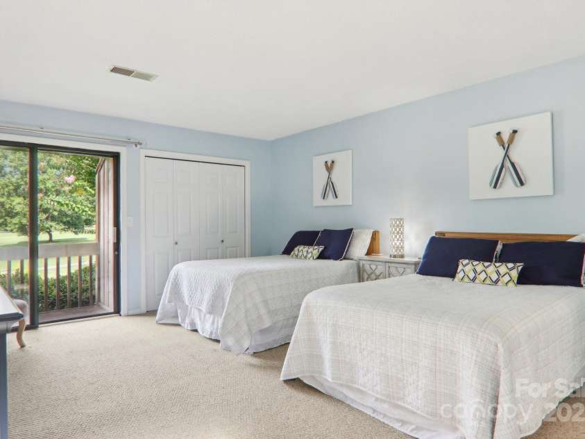 182 Lake Drive, Lake Lure, NC 28746.  MLS# CAR4170164, YatesRealty ID 7965. Two queen beds
