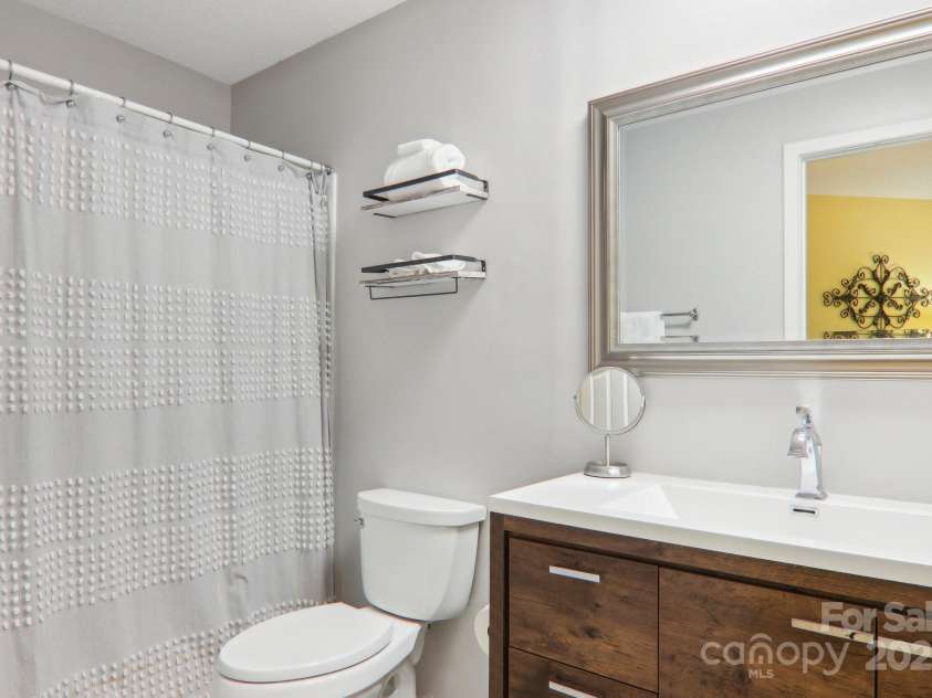 182 Lake Drive, Lake Lure, NC 28746.  MLS# CAR4170164, YatesRealty ID 7965. Updated bathroom with stand up shower