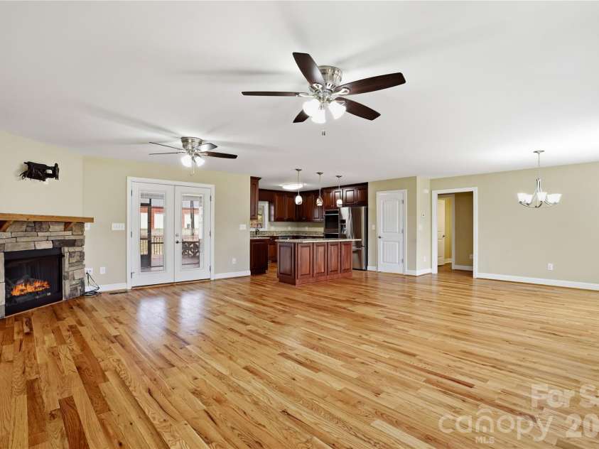 575 Hill Road, Lincolnton, NC 28092.  MLS# CAR4343352, YatesRealty ID 7966. Open-concept living with warm fireplace and natural light