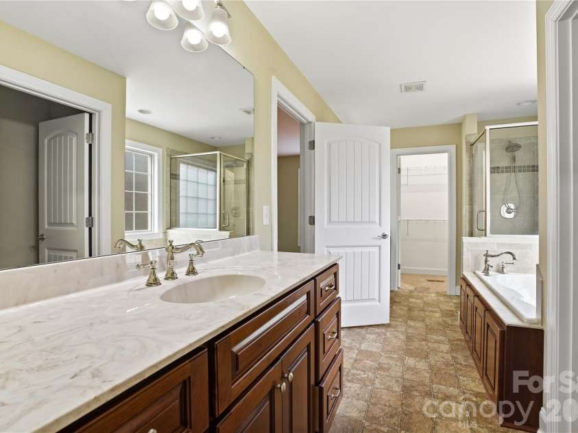 575 Hill Road, Lincolnton, NC 28092.  MLS# CAR4343352, YatesRealty ID 7966. Primary suite retreat with soaking tub and dual vanities