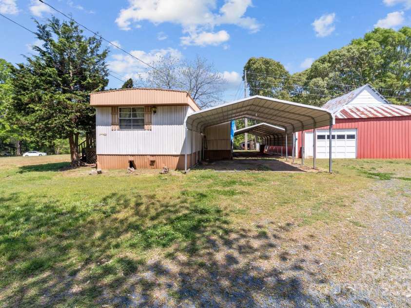 4734 Polk Ford Road, Stanfield, NC 28163.  MLS# CAR4248894, YatesRealty ID 7971. Mobile and Barn