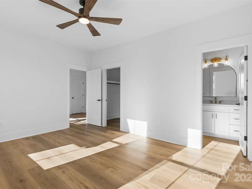 4734 Polk Ford Road, Stanfield, NC 28163.  MLS# CAR4321692, YatesRealty ID 7971. *representative photo- bedroom one w/ ensuite full bath