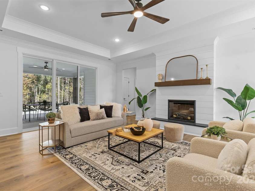 4734 Polk Ford Road, Stanfield, NC 28163.  MLS# CAR4321692, YatesRealty ID 7971. *representative photo- family room w/ tray ceiling, shiplap fireplace & cedar mantle!