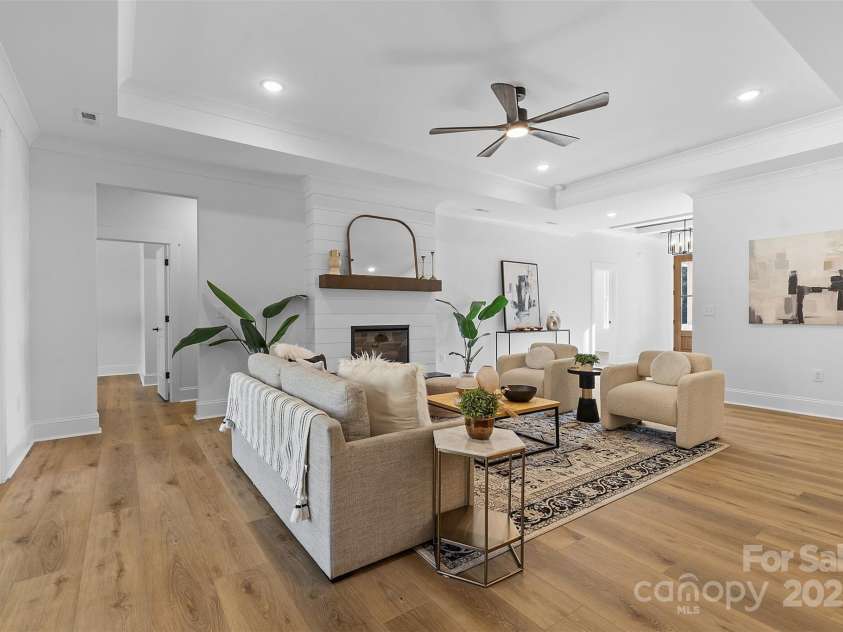 4734 Polk Ford Road, Stanfield, NC 28163.  MLS# CAR4321692, YatesRealty ID 7971. *representative photo- family room w/ tray ceiling, shiplap fireplace & cedar mantle!