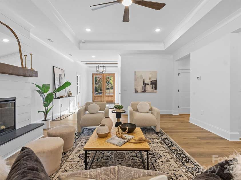 4734 Polk Ford Road, Stanfield, NC 28163.  MLS# CAR4321692, YatesRealty ID 7971. *representative photo- family room w/ tray ceiling, shiplap fireplace & cedar mantle!