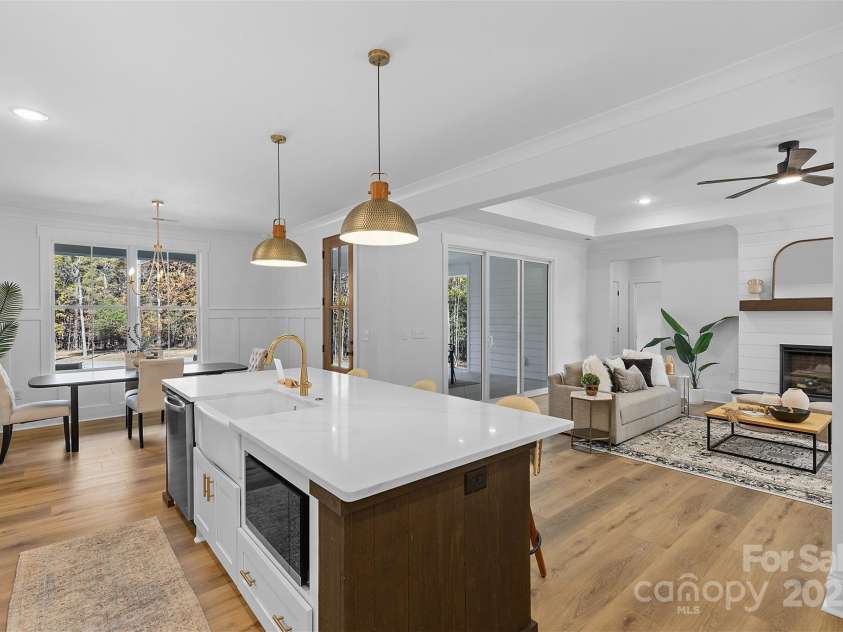 4734 Polk Ford Road, Stanfield, NC 28163.  MLS# CAR4321692, YatesRealty ID 7971. *representative photo- gourmet kitchen w/ custom wood hood vent, double oven, microwave built into the island, oversized level 3 quartz countertops, porcelain farmhouse sink