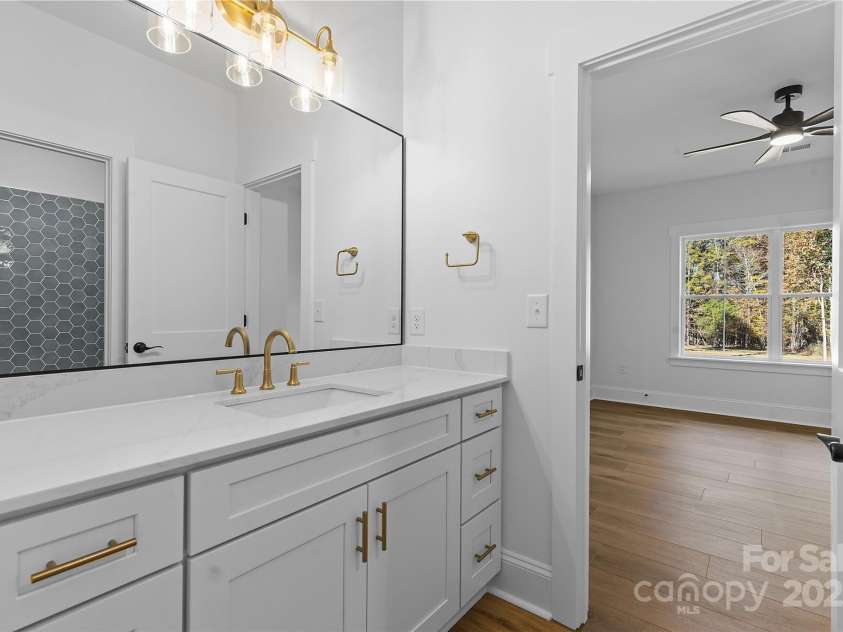 4734 Polk Ford Road, Stanfield, NC 28163.  MLS# CAR4321692, YatesRealty ID 7971. *representative photo- jack & jill full bath connecting bedrooms 3 & 4. pocket door and separate commode room