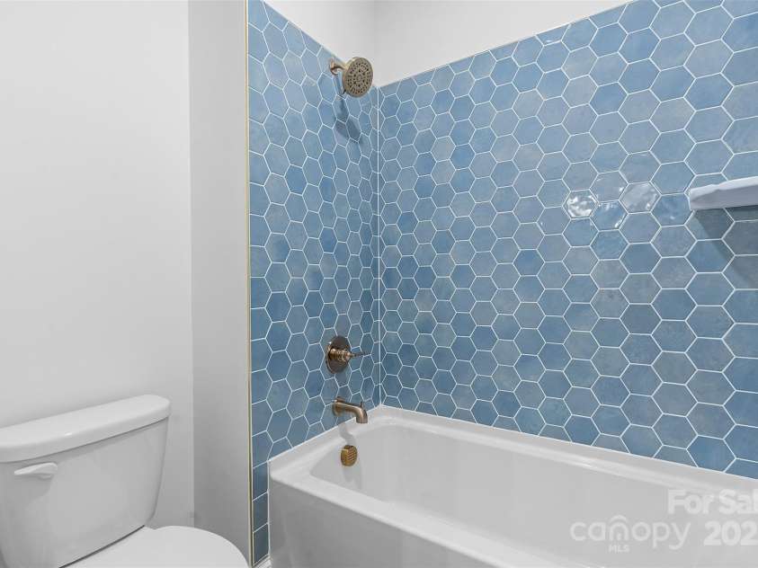 4734 Polk Ford Road, Stanfield, NC 28163.  MLS# CAR4321692, YatesRealty ID 7971. *representative photo- jack & jill full bath connecting bedrooms 3 & 4. pocket door and separate commode room