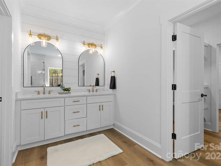 4734 Polk Ford Road, Stanfield, NC 28163.  MLS# CAR4321692, YatesRealty ID 7971. *representative photo- primary ensuite full bath w/ tub, frameless custom tiled shower, separate commode room