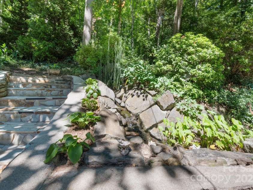 78 Sleepy Hollow Drive, Asheville, NC 28805.  MLS# CAR4155271, YatesRealty ID 7988. Back Yard Water Feature