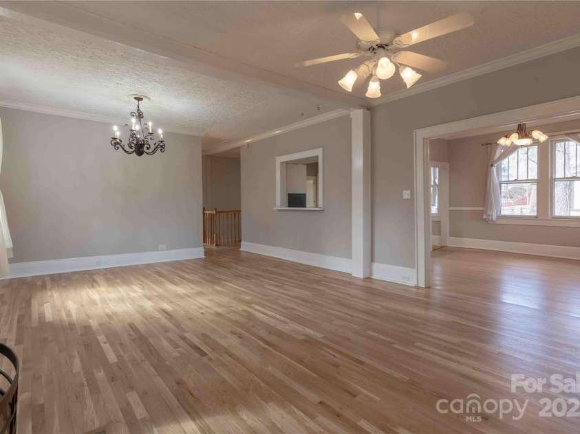 311 Buncombe Street, Hendersonville, NC 28739.  MLS# CAR4176141, YatesRealty ID 7991. Spacious living room opens to dining room