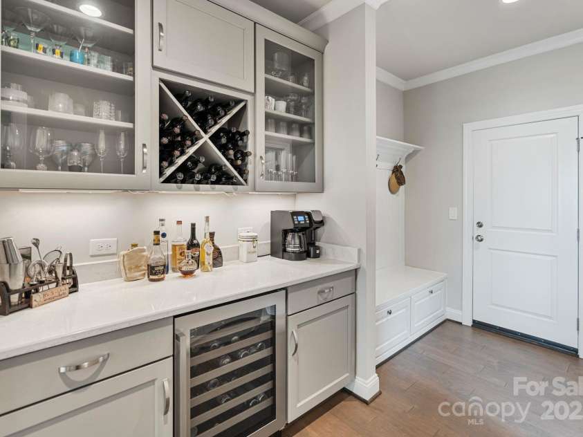 20601 Island Forest Drive, Cornelius, NC 28031.  MLS# CAR4232070, YatesRealty ID 7997. Convenient bar area with beverage fridge off kitchen.